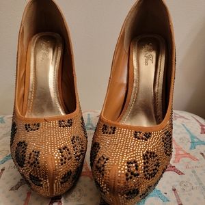 Black and gold platform heels